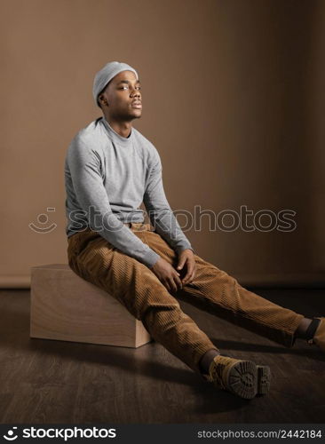 portrait male wearing cap sitting 2