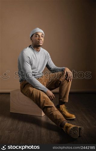 portrait male wearing cap sitting 3