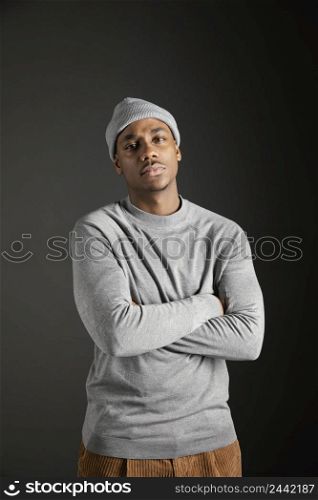 portrait male wearing cap with arms crossed 2