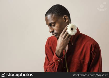 portrait man holding flower with copy space