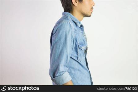 Portrait Man in Jeans Shirt or Denim Shirt Fashion in Side View. Jeans shirt or denim shirt fashion for men on grey background
