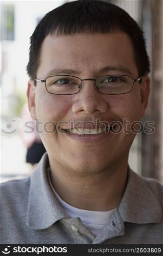 Portrait man sitting at outdoor restaurant