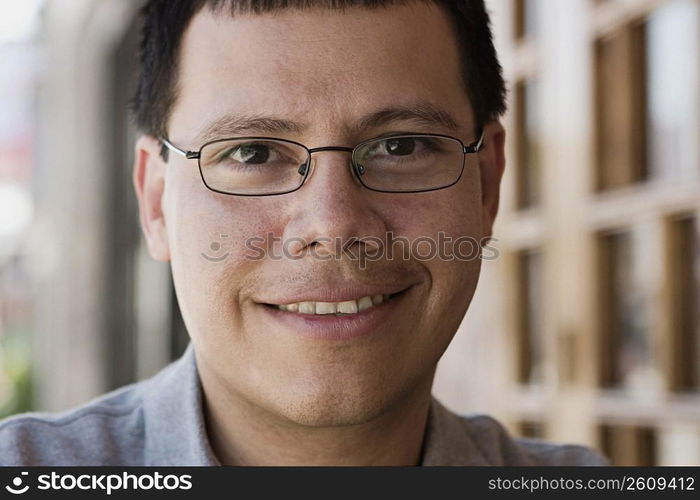 Portrait man sitting at outdoor restaurant