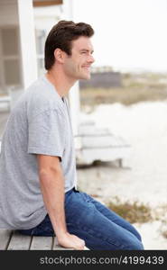 Portrait man sitting outdoors