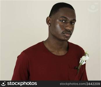 portrait man t shirt with flowers his chest pocket 3