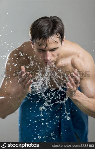 portrait man washing his face