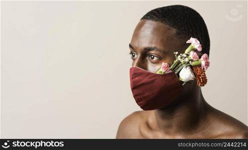 portrait man wearing face mask flowers with copy space