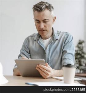 portrait man working tablet