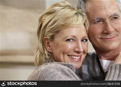 Portrait, mature couple hugging, close-up