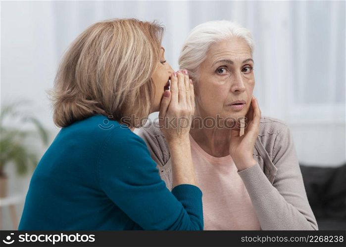 portrait mature women whispering