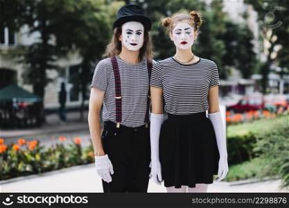 portrait mime couple standing park