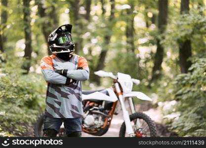 portrait motorbike rider posing forrest