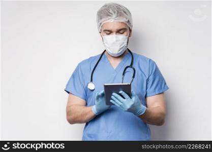 portrait nurse browsing tablet