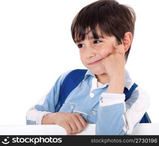 Portrait of a adorable school boy thinking on white isolated background