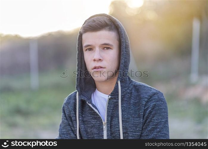 portrait of a attractive teenager standing and looking to you