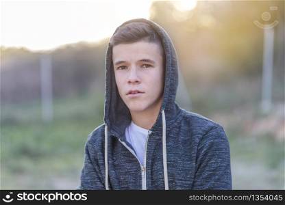 portrait of a attractive teenager standing and looking to you