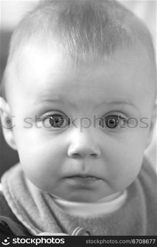 Portrait of a baby boy looking surprised