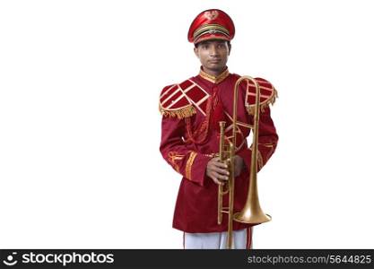 Portrait of a bandmaster holding a trumpet