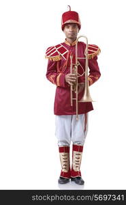 Portrait of a bandmaster holding a trumpet