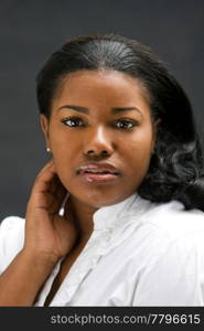 Portrait of a beautiful African-America woman in white shirt