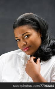 Portrait of a beautiful African-America woman in white shirt