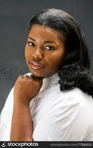 Portrait of a beautiful African-America woman in white shirt, isolated