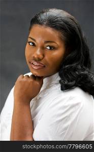 Portrait of a beautiful African-America woman in white shirt, isolated