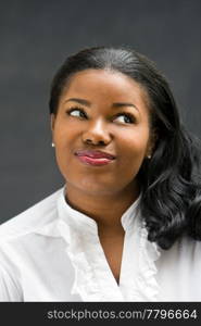 Portrait of a beautiful African-America woman in white shirt, isolated