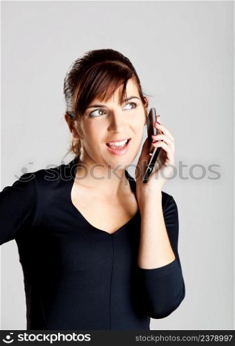 Portrait of a beautiful and attractive young woman making a phone call