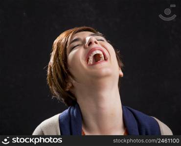 Portrait of a beautiful and happy woman laughing with a modern hair cut