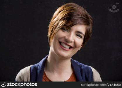 Portrait of a beautiful and happy woman smiling with a modern hair cut