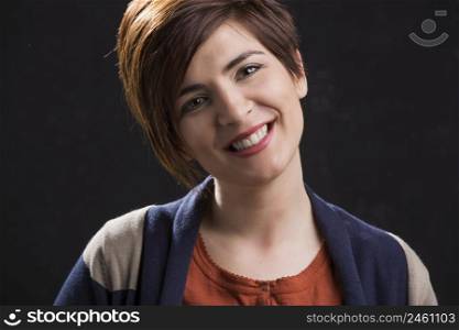 Portrait of a beautiful and happy woman smiling with a modern hair cut