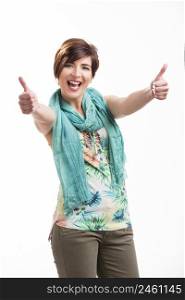 Portrait of a beautiful and happy woman with thumbs up, isolated over white background