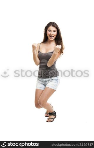 Portrait of a beautiful and happy young woman after winning something, isolated on white