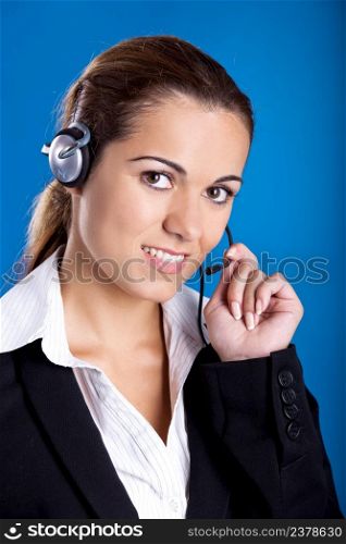 Portrait of a beautiful and young businesswoman with headsets