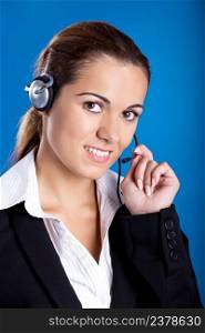 Portrait of a beautiful and young businesswoman with headsets