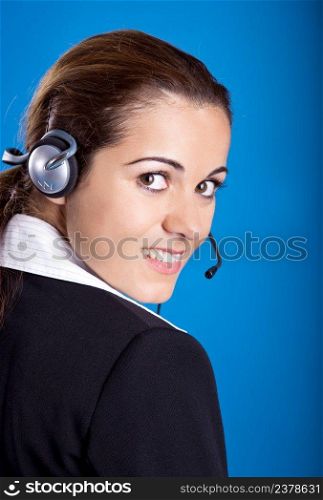 Portrait of a beautiful and young businesswoman with headsets 