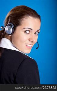 Portrait of a beautiful and young businesswoman with headsets 