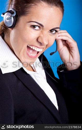 Portrait of a beautiful and young businesswoman with headsets and laughing 