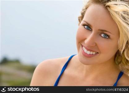 portrait of a beautiful blond haired blue eyed model shot outside with natural light