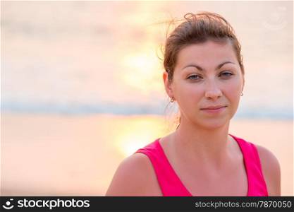 portrait of a beautiful brunette in a pink t-shirt