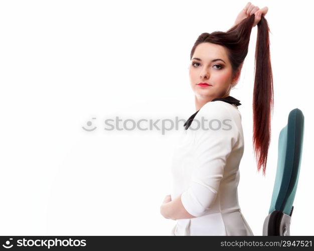 Portrait of a beautiful brunette young business woman sitting on chair white background