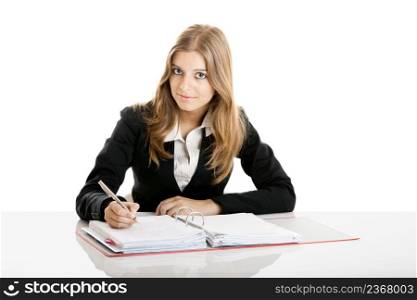 Portrait of a beautiful business woman in the office doing some paperwork