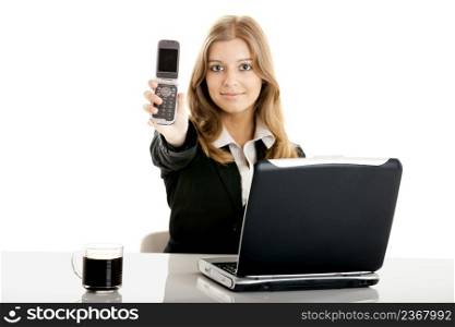 Portrait of a beautiful business woman in the office using a cellphone