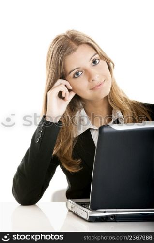 Portrait of a beautiful business woman working at her desk with a laptop