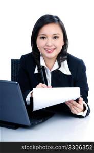 Portrait of a beautiful businesswoman holding clipboard and writing, over white background
