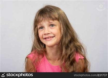Portrait of a beautiful eight-year-old gay girl of Europe who looks to the left