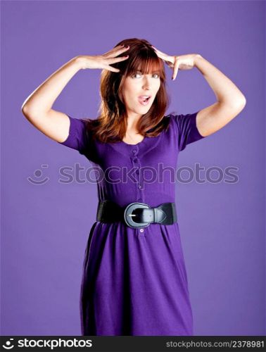 Portrait of a beautiful fashion woman over a violet background
