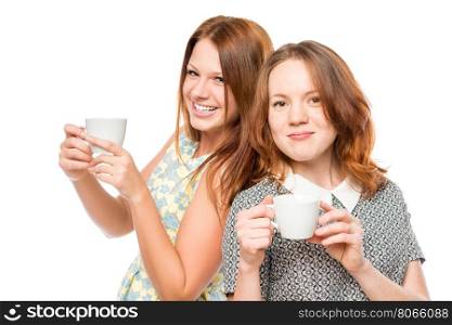portrait of a beautiful female friends with tea on a white background