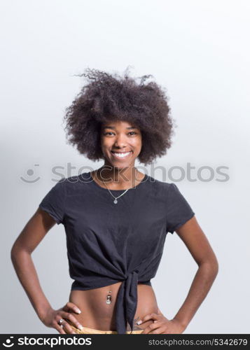 portrait of a beautiful friendly African American woman with a curly afro hairstyle and lovely smile isolated on a white background